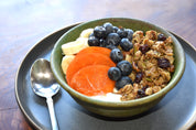 bowl of granola and fruit, granola with dried cherries pistachios coconut maple syrup healthy granola, healthy granola bowl, magnolia granol-ia la jolla farmers market, la jolla open aire market, best granola san diego, best granola in the world, granola bowl recipes, granola breakfast recipes, healthy granola, delicious granola san diego, eleven madison park granola san diego, eleven madison park granola best granola ever